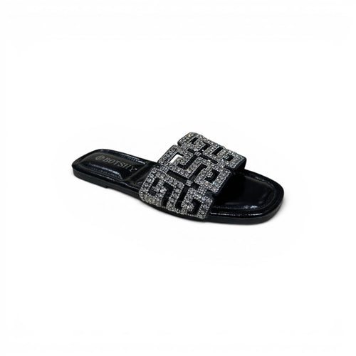 COC Store black slide sandals with geometric rhinestone embellished strap. Flat sole, slip-on design.