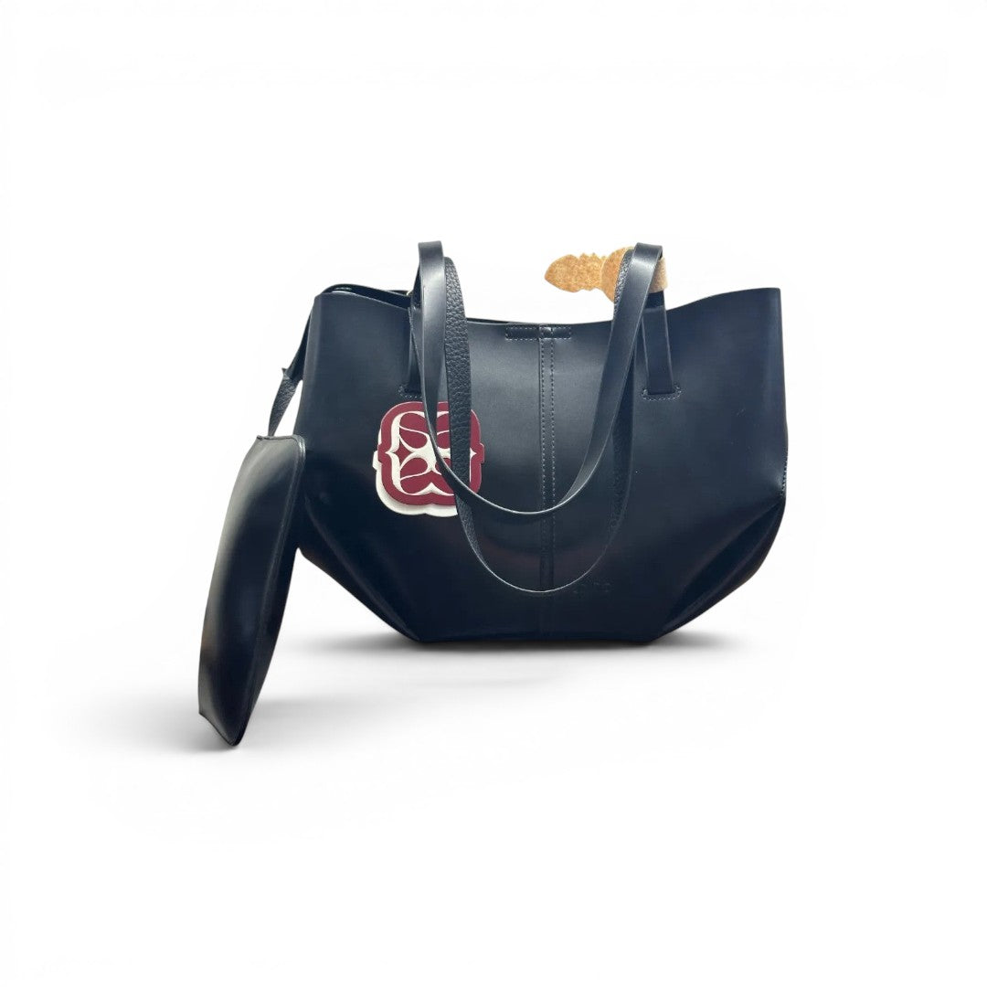 COC Store black vegan leather structured tote bag with top handles and matching clutch. Features a decorative logo tag.