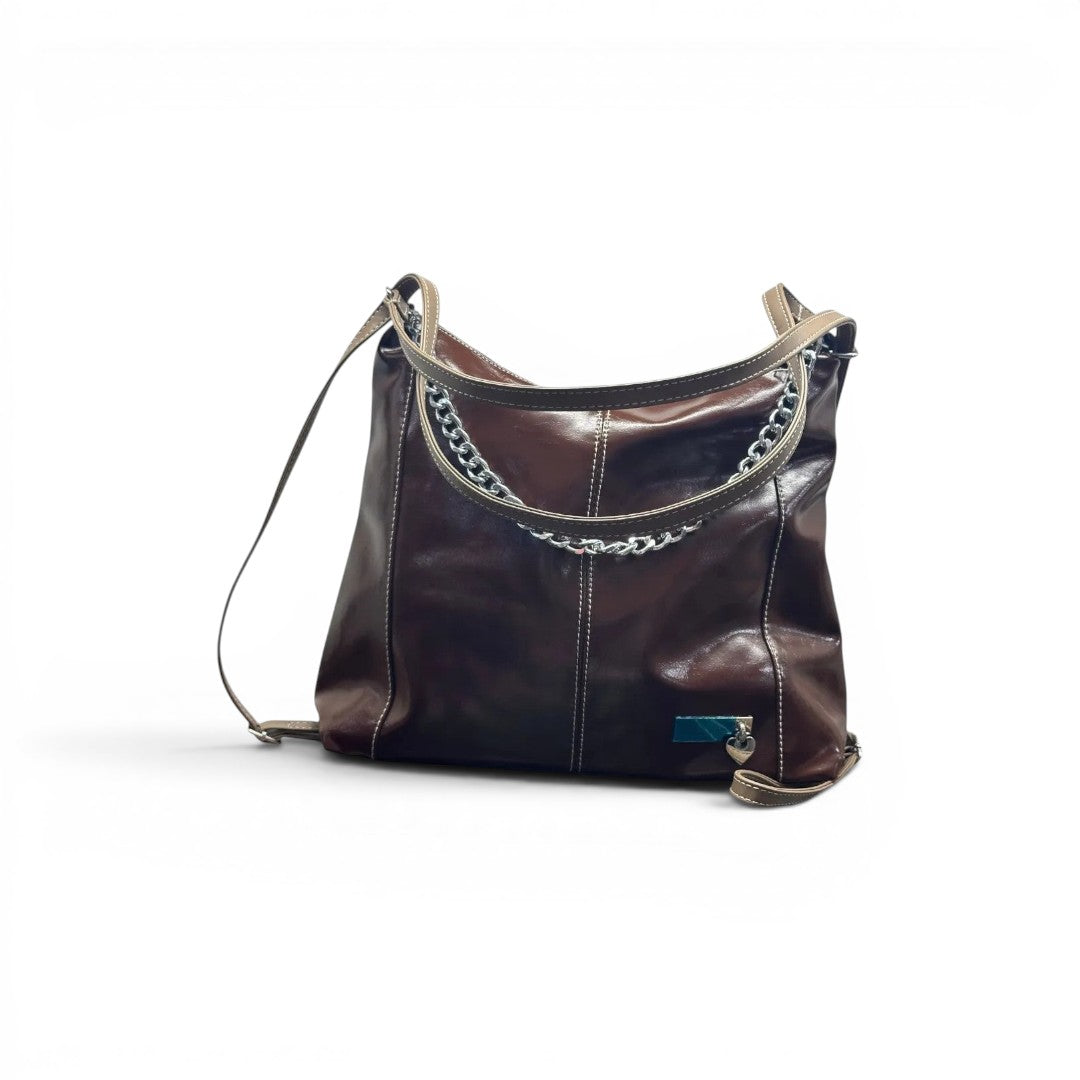 COC Store brown glossy faux leather shoulder bag with tan straps, white stitching, and silver chain detail.