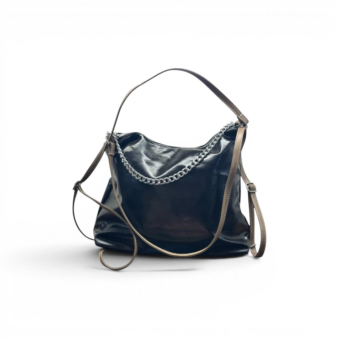 COC Store glossy faux leather shoulder bag in rich brown with tan straps, silver chain detail and adjustable strap.