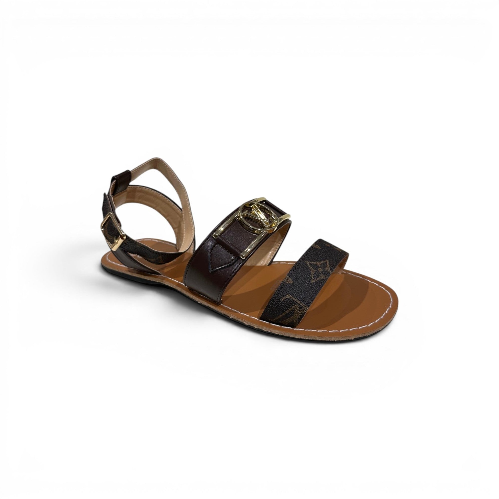 COC Store brown monogram flat sandals with adjustable ankle strap and gold buckle.