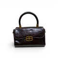 COC Store brown patent leather and taupe suede handbag with gold clasp and top handle