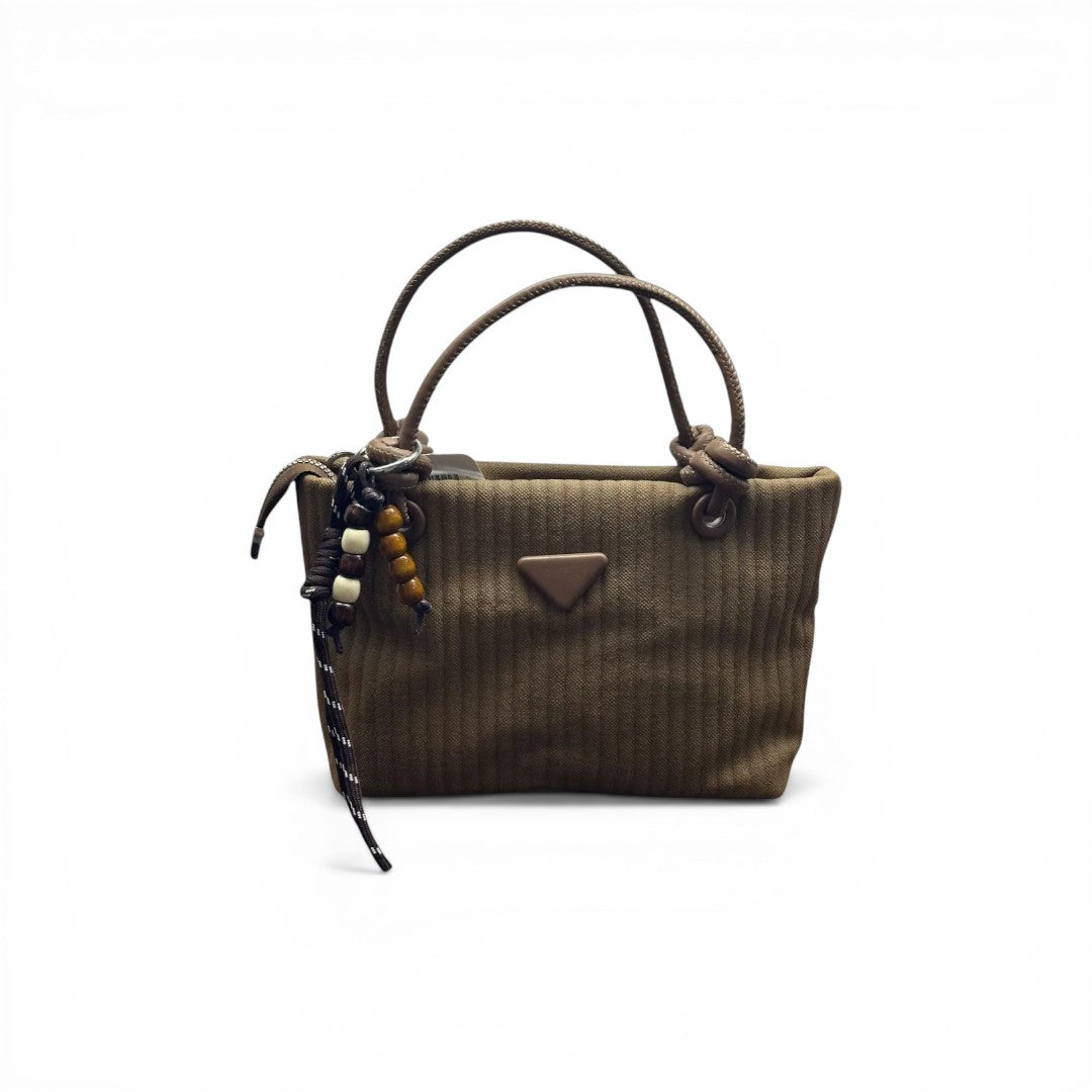 COC Store brown textured tote bag with faux leather handles and beaded charm. Features triangular emblem.