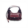 COC Store burgundy faux leather hobo bag with contrast stitching and buckle flap pocket. Adjustable strap.