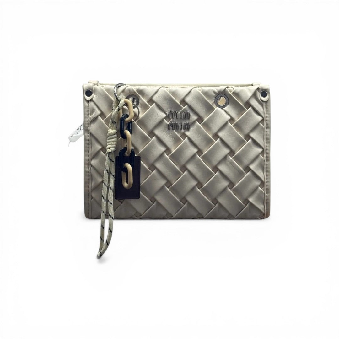 COC Store cream woven faux leather crossbody bag with charm and silver-tone hardware.