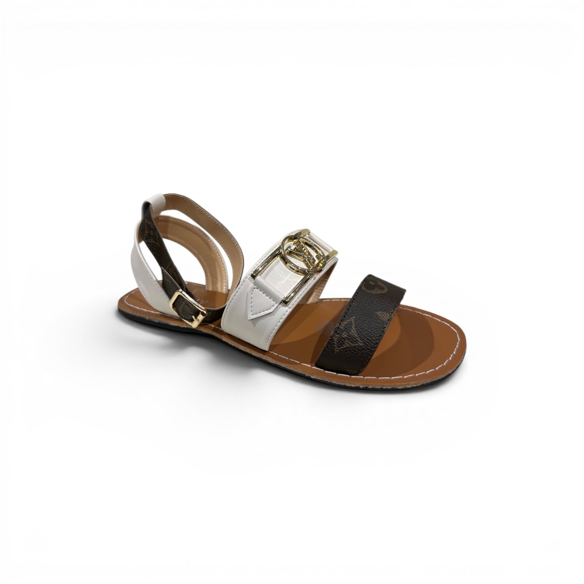 COC Store designer inspired flat sandals with brown monogram print, white strap, and gold buckle.