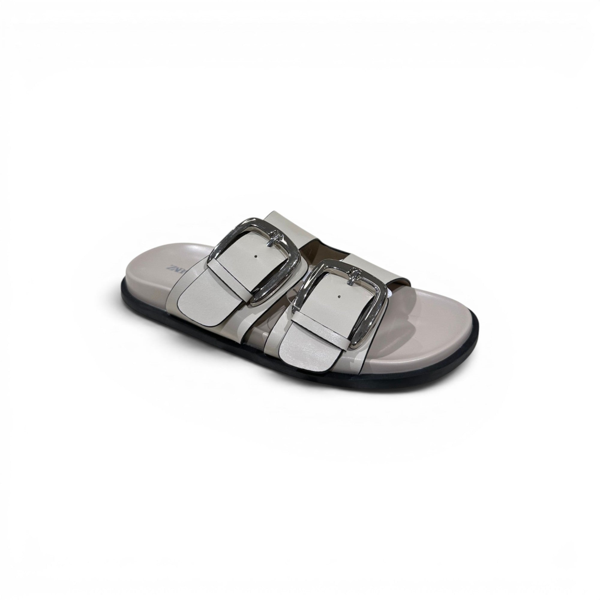 COC Store off-white faux leather double buckle slide sandals with silver-tone hardware.