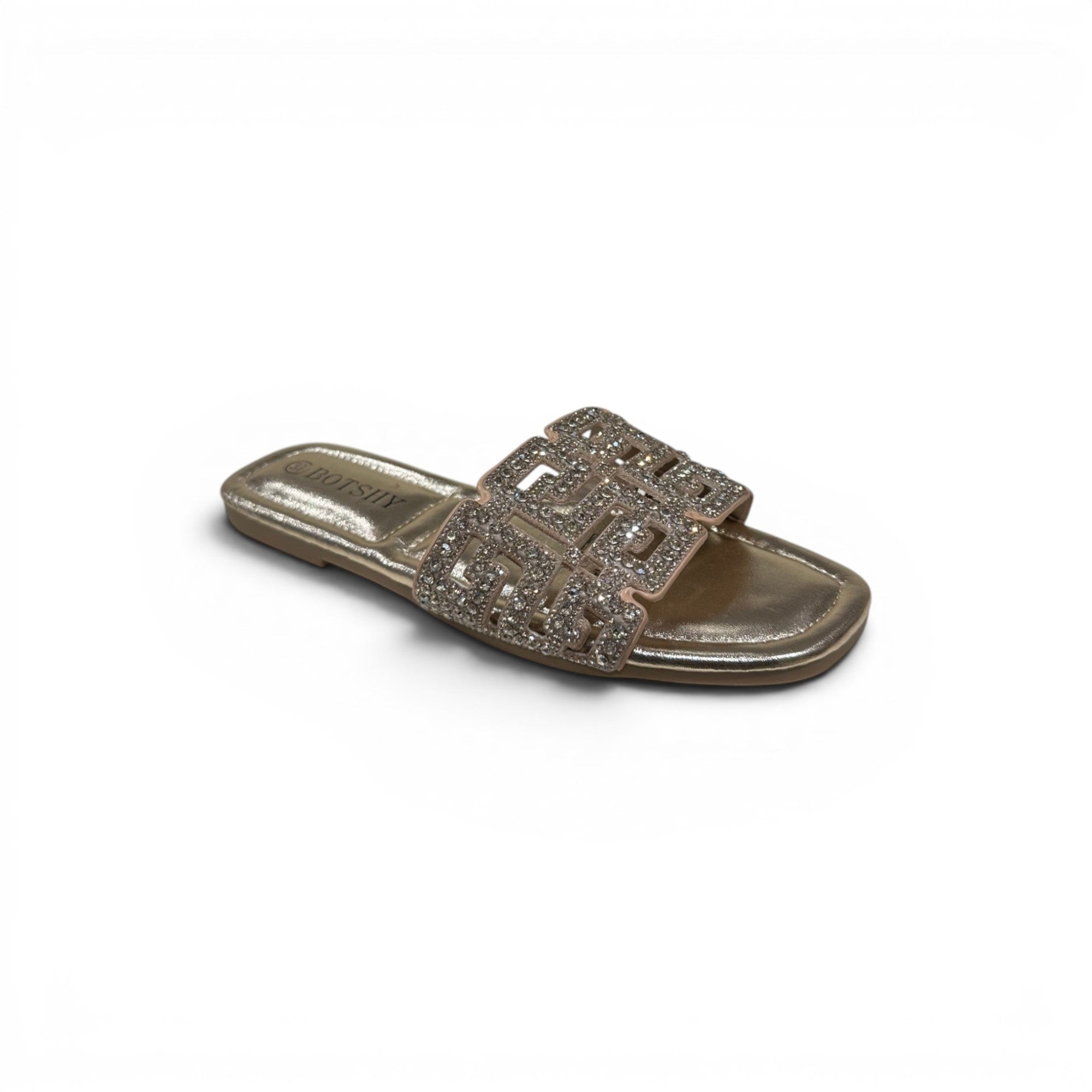 COC Store gold slide sandals with geometric strap adorned with rhinestones.