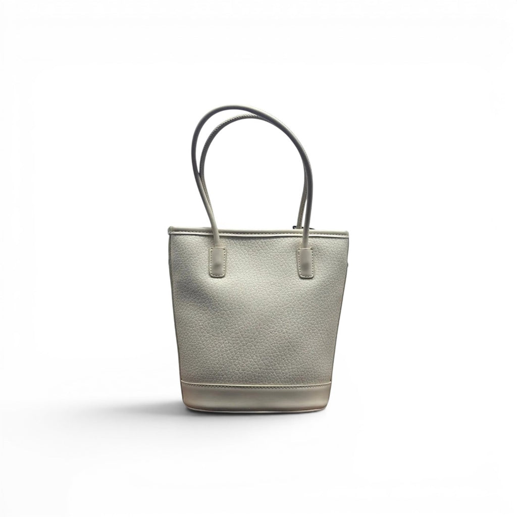 COC Store light grey textured faux leather bucket tote bag with top handles and charm detail.