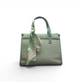 COC Store structured mint green faux leather tote bag with ribbed texture and decorative scarf accent.
