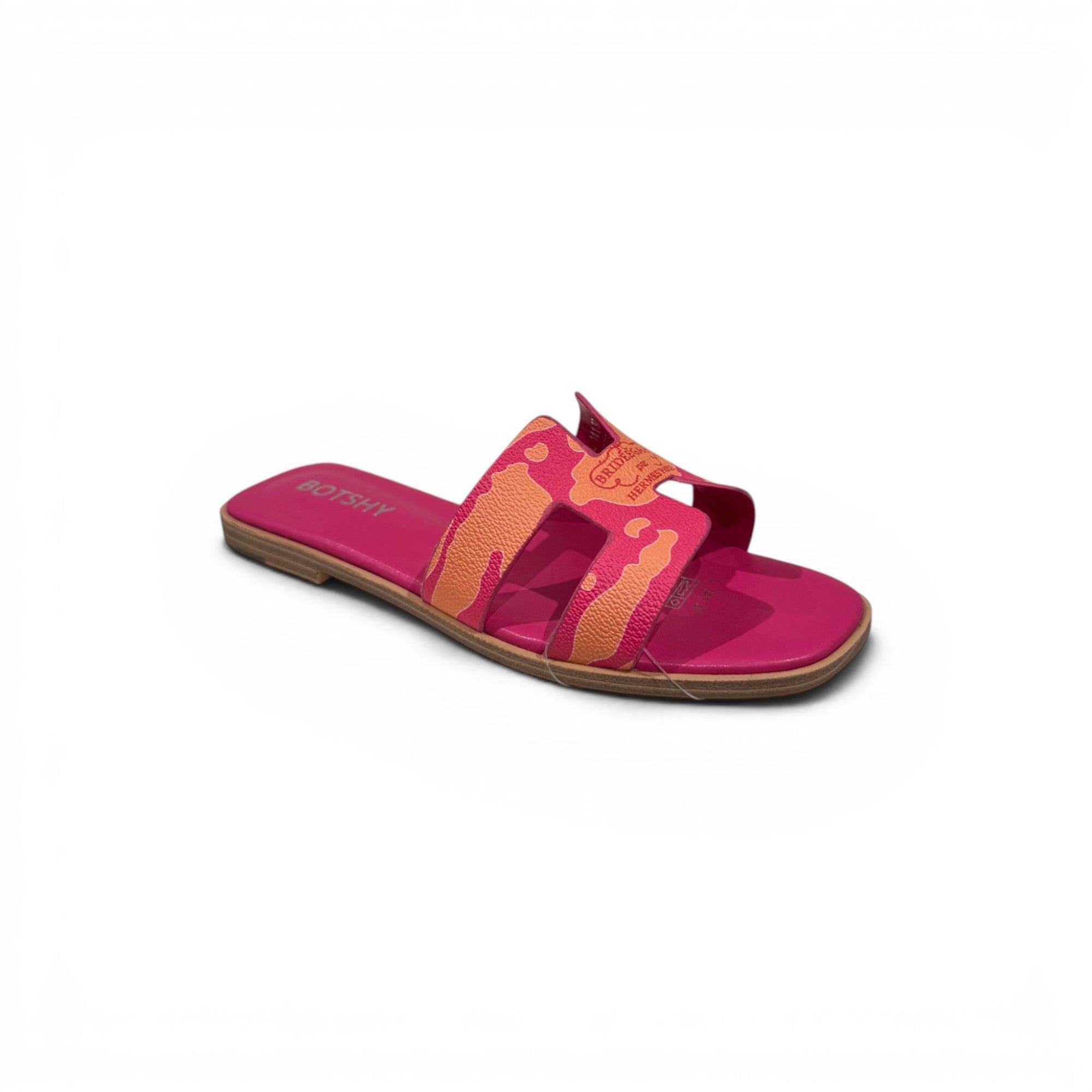 COC Store pink slide sandals with orange tiger-stripe H-strap design. Flat sole, slip-on style.