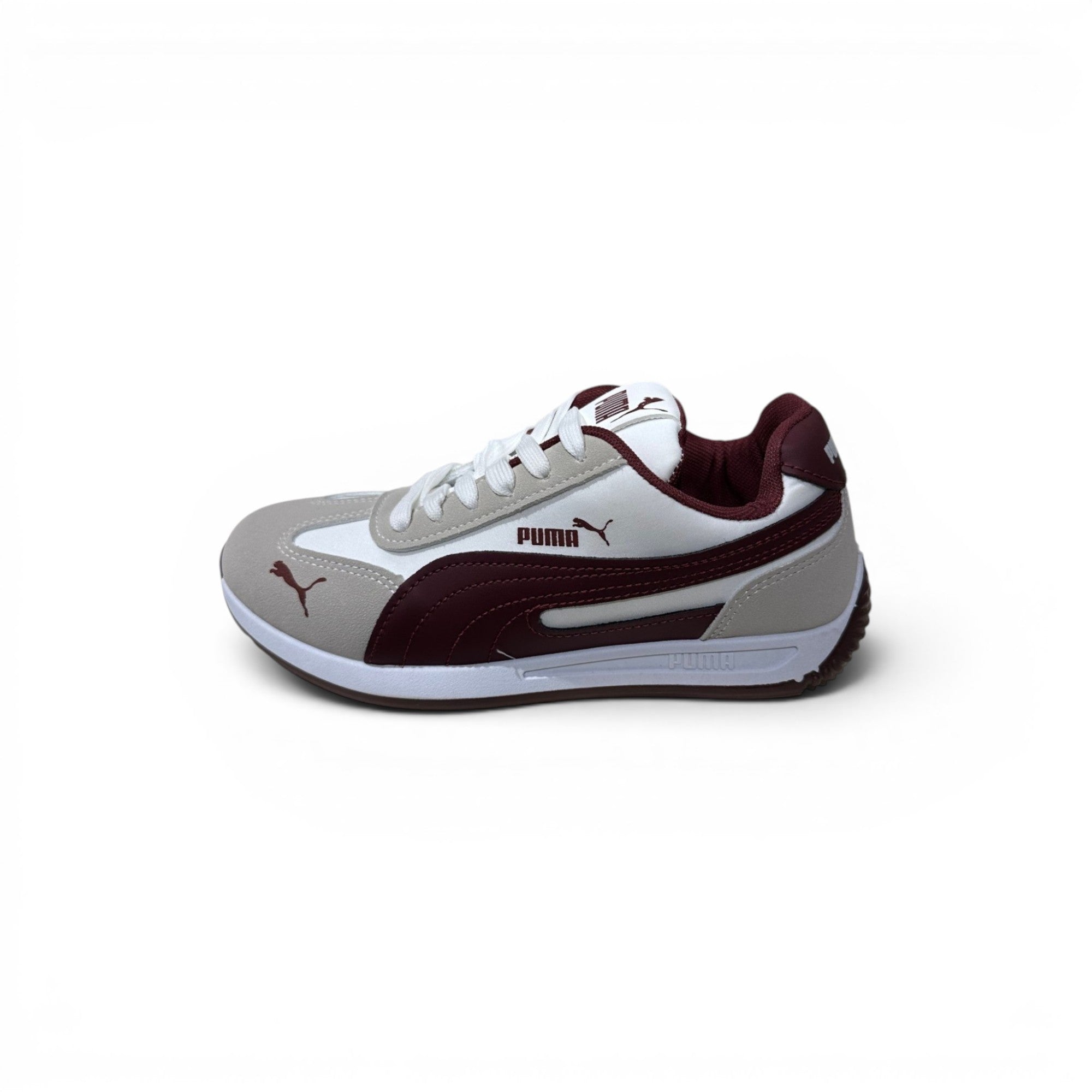 COC Store Puma kids casual sneakers in white, grey, and burgundy. Features a cushioned sole and sleek silhouette.