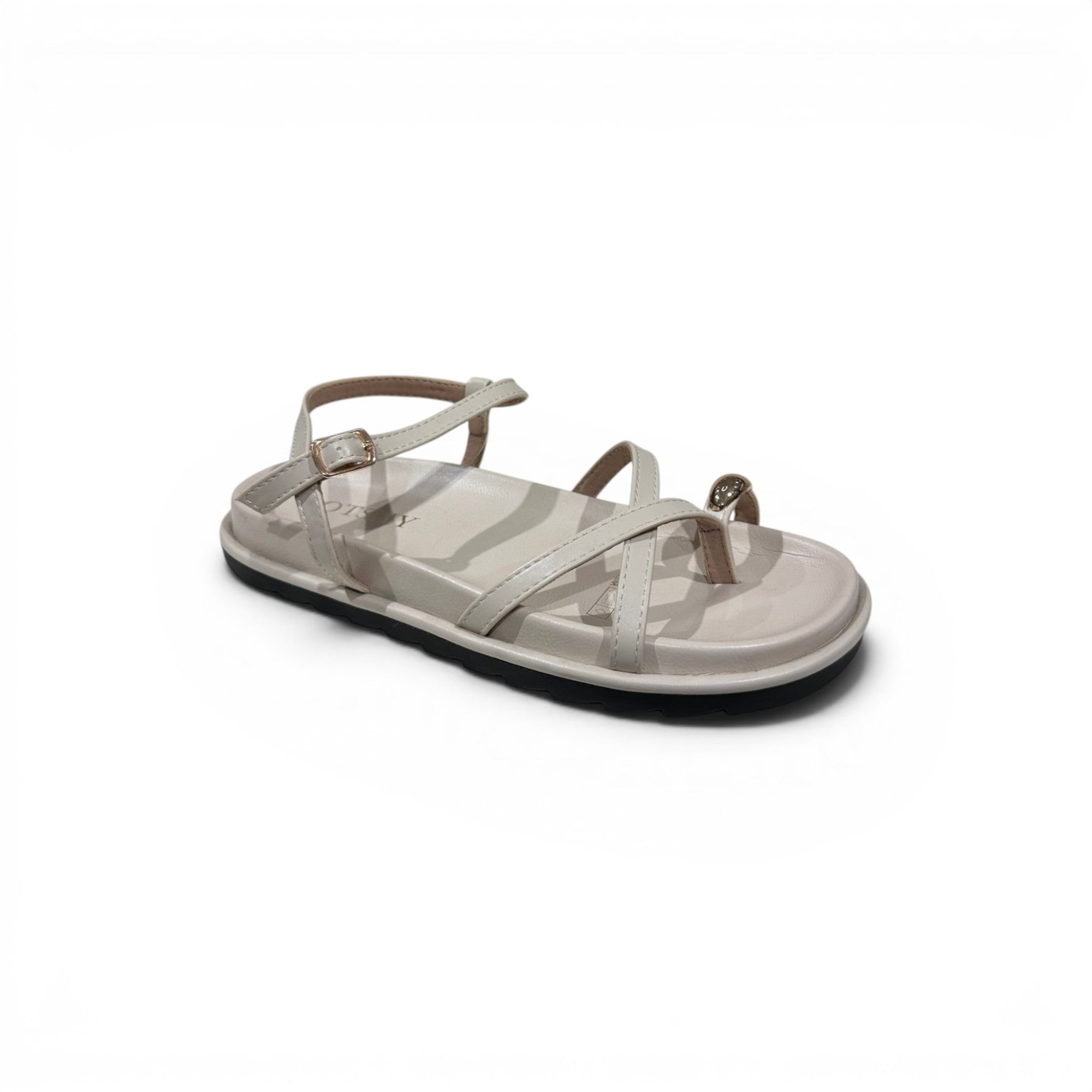 COC Store cream flat sandals with criss-cross straps, ankle buckle, and toe ring accent.