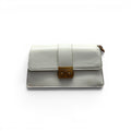 COC Store white faux leather clutch bag with gold-tone clasp closure and structured shoulder strap detail.