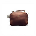 COC Store brown faux leather crossbody bag with gold-tone logo and adjustable strap.