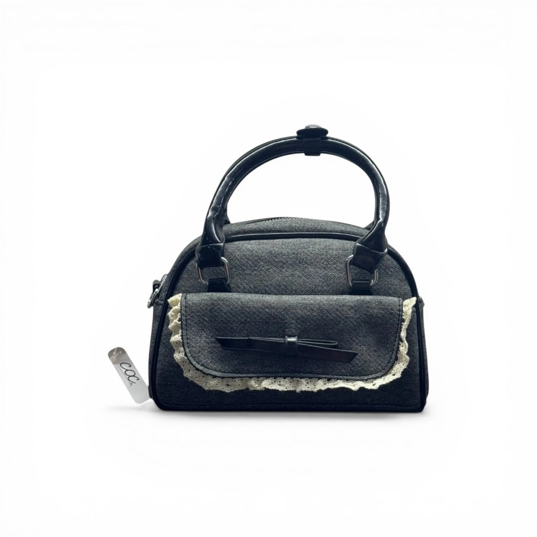COC Store grey denim handbag with patent handles, lace trim, and black bow detail on front pocket.