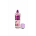 Victoria's Secret Pure Seduction fragrance mist, 250ml, with pink liquid and floral accents. Purple cap.